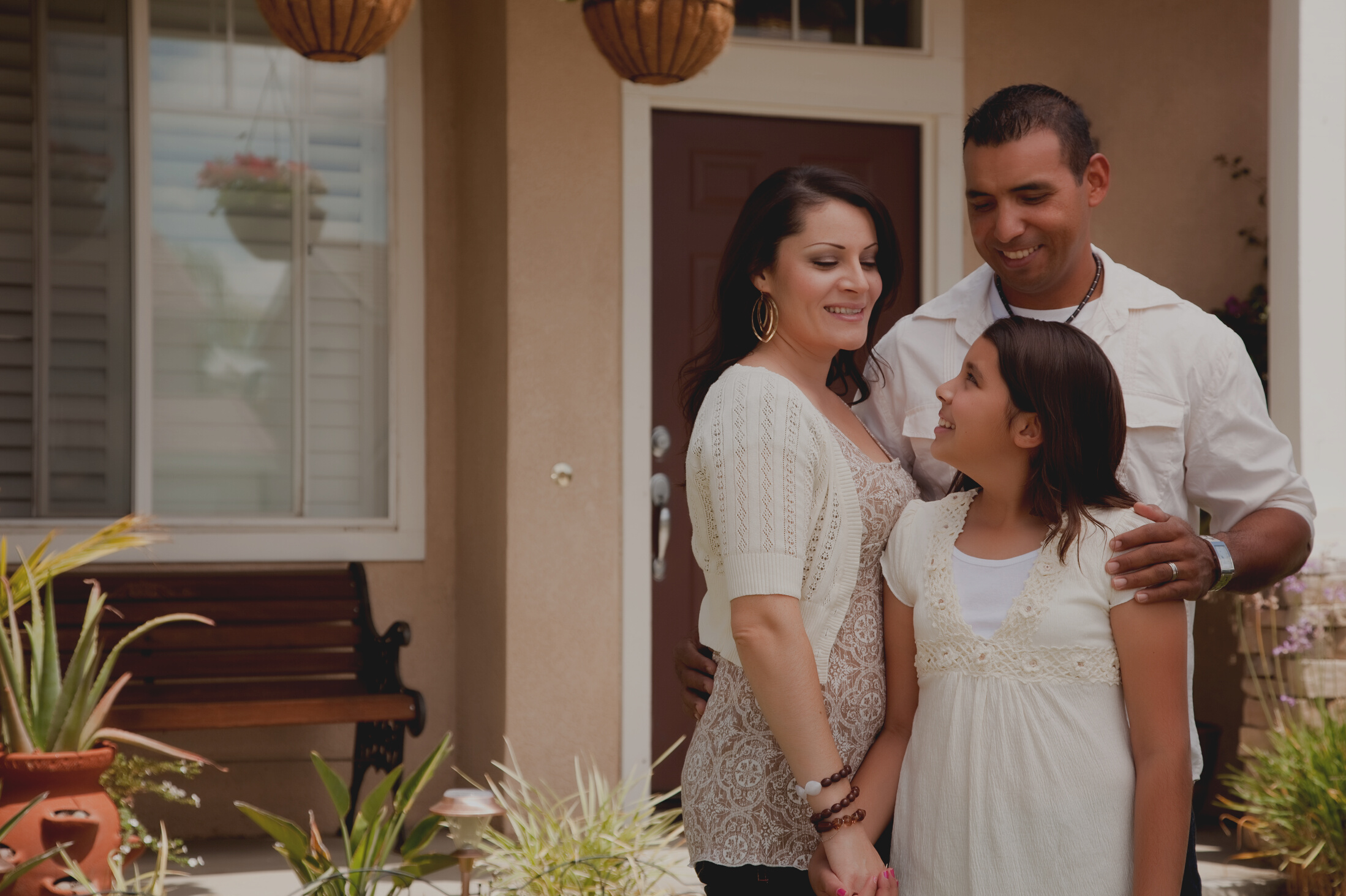 Family in Front of Home