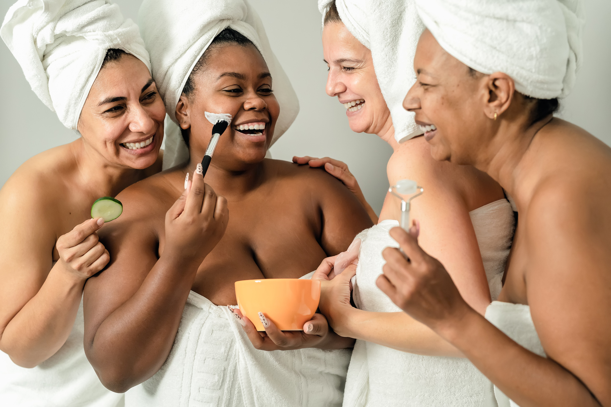 Happy multiracial women with different age and body size having skin care spa day - People selfcare concept