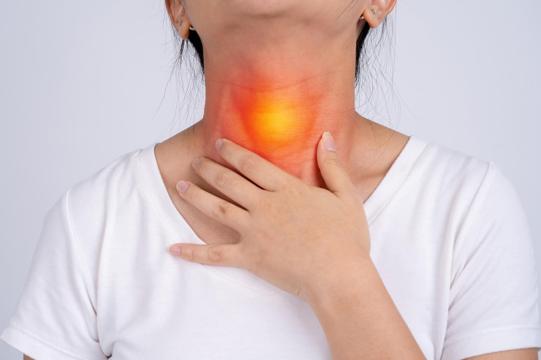 Woman with Pain in the Throat on a White Background She Has Tons